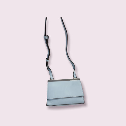NUEVO - Cartera celeste International Concepts INC - SOLO QUEDA 1 UNIDAD