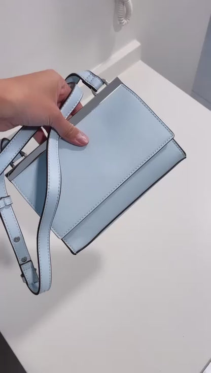 NUEVO - Cartera celeste International Concepts INC - SOLO QUEDA 1 UNIDAD